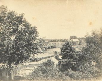The Madawaska bridge and the McLachlin Brothers office in 1894